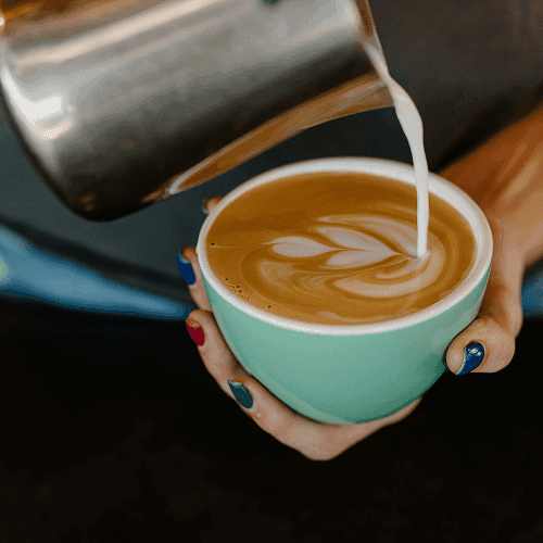 Milk being added into a coffee