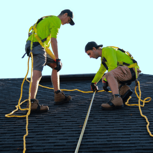 Roofers fixing a roof